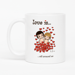 Load image into Gallery viewer, Love is... all around us personalized ceramic mug by Kim Casali. 
