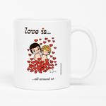 Load image into Gallery viewer, Front view: Love is... all around us personalized ceramic mug by Kim Casali. 
