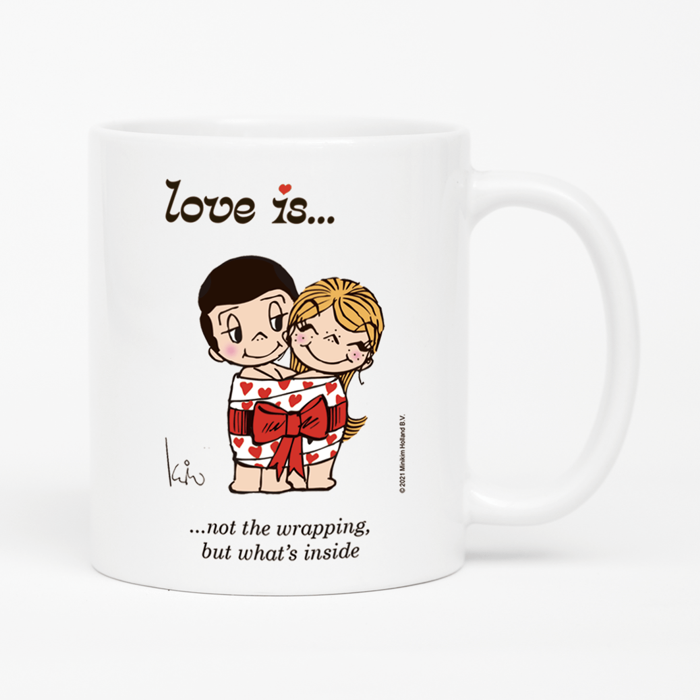Front view: Love is... not the wrapping, but what's inside  personalized ceramic mug by Kim Casali. 