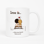 Load image into Gallery viewer, Front view: Love is... when two hearts beat as one personalized ceramic mug by Kim Casali.
